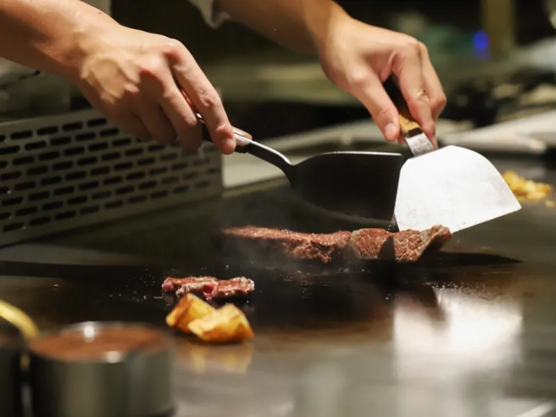 Chef cooking hibachi steak at U Sushi & Hibachi, a Japanese Restaurant in Ormond Beach